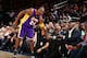 NEW YORK, NY - NOVEMBER 8: Kobe Bryant #24 of the Los Angeles Lakers reaches out to Magic Johnson during the game against the New York Knicks on November 8, 2015 at Madison Square Garden in New York, New York. NOTE TO USER: User expressly acknowledges and