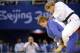Edith Bosch, in blue, against Ronda Rousey at the 2008 Olympics.