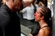 BERLIN, GERMANY - JUNE 20: The referee interacts with Jessica Penne (R) of the United States after calling the fight against Joanna Jedrzejczyk of Poland in their women's strawweight championship bout during the UFC Fight Night event at the O2 World on J