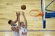 MADRID, SPAIN - OCTOBER 08: Luka Doncic (R) of Real Madrid and his teammate Guillermo Hernangomez (L) goes up for a rebound during the friendlies of the NBA Global Games 2015 basketball match between Real Madrid and Boston Celtics at Barclaycard Center on