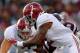 STARKVILLE, MS - NOVEMBER 14: Derrick Henry #2 of the Alabama Crimson Tide rushes against the Mississippi State Bulldogs at Davis Wade Stadium on November 14, 2015 in Starkville, Mississippi. (Photo by Kevin C. Cox/Getty Images)