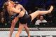 MELBOURNE, AUSTRALIA - NOVEMBER 15: (R-L) Holly Holm of the United States takes down Ronda Rousey of the United States in their UFC women's bantamweight championship bout during the UFC 193 event at Etihad Stadium on November 15, 2015 in Melbourne, Austr