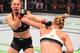 MELBOURNE, AUSTRALIA - NOVEMBER 15: (R-L) Holly Holm of the United States punches Ronda Rousey of the United States in their UFC women's bantamweight championship bout during the UFC 193 event at Etihad Stadium on November 15, 2015 in Melbourne, Australi