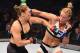 MELBOURNE, AUSTRALIA - NOVEMBER 15: (R-L) Holly Holm of the United States punches Ronda Rousey of the United States in their UFC women's bantamweight championship bout during the UFC 193 event at Etihad Stadium on November 15, 2015 in Melbourne, Australi
