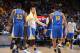 DENVER, CO - NOVEMBER 22: Stephen Curry #30 of the Golden State Warriors high fives teammates Draymond Green #23 and Leandro Barbosa #19 during the game against the Denver Nuggets on November 22, 2015 at the Pepsi Center in Denver, Colorado. NOTE TO USER
