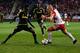 HARRISON, NJ - NOVEMBER 29: Mike Grella #13 of New York Red Bulls drives by Harrison Afful #25 of Columbus Crew during their match at Red Bull Arena on November 29, 2015 in Harrison, New Jersey. (Photo by Jeff Zelevansky/Getty Images)