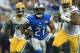 DETROIT, MI - DECEMBER 3: Ameer Abdullah #21 of the Detroit Lions carries the ball in the first quarter of the game against the Green Bay Packers at Ford Field on December 3, 2015 in Detroit, Michigan. (Photo by Andrew Weber/Getty Images)