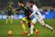 AC Milan's midfielder from Italy Giacomo Bonaventura (L) vies Carpi's midfielder from Italy Lorenzo Pasciuti (R) during the Italian Serie A football match Carpi vs AC Milan at the Braglia stadium in Modena on December 6, 2015. AFP PHOTO / VINCENZO PINT