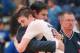 Characterized as "humble and kind to everyone" by his mother, Tracy, Luke Kornet and his father share a hug during Senior Night at Liberty Christian Academy.