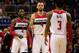 WASHINGTON, DC - DECEMBER 16: John Wall #2, Marcin Gortat #4, and Bradley Beal #3 of the Washington Wizards celebrate during the closing mintues of the Wizards 109-95 win over the Minnesota Timberwolves at Verizon Center on December 16, 2014 in Washington