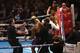 Referee Howard Foster (C white shirt) tries to separate British boxer Dillian Whyte (2L) and British boxer Anthony Joshua (R) after the bell had rang in round one during their British and Commonwealth heavyweight title boxing match at the O2 arena in Lond