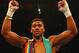 LONDON, ENGLAND - DECEMBER 12: Anthony Joshua celebrates victory over Dillian Whyte with his belts after the British and Commonwealth heavyweight title contest at The O2 Arena on December 12, 2015 in London, England. (Photo by Richard Heathcote/Getty Im
