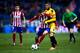 MADRID, SPAIN - DECEMBER 17: Yannick Carrasco (L) of Atletico de Madrid competes for the ball with Alex Colorado (R) of CF Reus during the Copa del Rey Round of 32 match between Club Atletico Madrid and CF Reus Deportiu at Vicente Claderon stadium on Dec