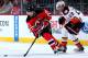 NEWARK, NJ - DECEMBER 19: Kyle Palmieri #21 of the New Jersey Devils takes the puck as Shawn Horcoff #22 of the Anaheim Ducks defends on December 19, 2015 at Prudential Center in Newark, New Jersey.The Anaheim Ducks defeated the New Jersey Devils 2-1. (