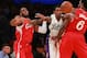 LOS ANGELES, CA - DECEMBER 25: Lou Williams #23 of the Los Angeles Lakers pursues the ball between Chris Paul #3 and DeAndre Jordan #6 of the Los Angeles Clippers in the second half of their NBA game at Staples Center on December 25, 2015 in Los Angeles,