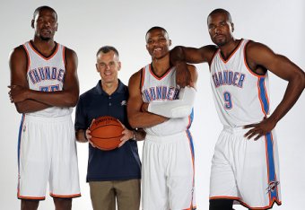 OKLAHOMA CITY, OK - SEPTEMBER 28: Kevin Durant #35, head coach Billy Donovan, Russell Westbrook #0 and Serge Ibaka #9 of the Oklahoma City Thunder pose for a portrait during 2015 NBA Media Day on September 28, 2015 at the Thunder Events Center in Edmond,