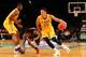 Nov 24, 2015; Brooklyn , NY, USA; LSU Tigers forward Ben Simmons (25) drives past North Carolina State Wolfpack guard Anthony Barber (12) during the second half in the consolation game of the Legends Classic at Barclays Center. North Carolina State Wolfp