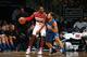 WASHINGTON, DC - JANUARY 1: John Wall #2 of the Washington Wizards defends the ball against Nikola Vucevic #9 of the Orlando Magic during the game on January 1, 2016 at Verizon Center in Washington, District of Columbia. NOTE TO USER: User expressly ackno