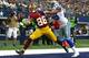 ARLINGTON, TX - JANUARY 03: Pierre Garcon #88 of the Washington Redskins attempts to make a touchdown catch against Deji Olatoye #29 of the Dallas Cowboys during the first half at AT&T Stadium on January 3, 2016 in Arlington, Texas. (Photo by Tom Penning