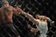 Carlos Condit fires a kick at Robbie Lawler at UFC 195.