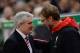 STOKE ON TRENT, ENGLAND - JANUARY 05: Jurgen Klopp (R), Manager of Liverpool is greeted by Mark Hughes the Manager of Stoke City during the Capital One Cup semi final, first leg match between Stoke City and Liverpool at the Britannia Stadium on January 5