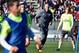 Real Madrid's new French coach Zinedine Zidane (C) runs past Real Madrid's Croatian midfielder Luka Modric (R) during his first training session as coach of Real Madrid at the Alfredo di Stefano stadium in Valdebebas, on the outskirts of Madrid, on Januar