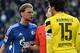 DORTMUND, GERMANY - FEBRUARY 28: (L-R) Benedikt Hoewedes of Schalke and Mats Hummels of Dortmund have a disagreement during the Bundesliga match between Borussia Dortmund and FC Schalke 04 at Signal Iduna Park on February 28, 2015 in Dortmund, Germany.