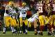 LANDOVER, MD - JANUARY 10: Quarterback Aaron Rodgers #12 of the Green Bay Packers calls from the line of scrimmage against the Washington Redskins in the third quarter during the NFC Wild Card Playoff game at FedExField on January 10, 2016 in Landover, Ma