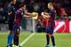 Xavi and Andres Iniesta helped provide the bedrock for Messi's success