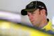 HOMESTEAD, FL - NOVEMBER 20: Matt Kenseth, driver of the #20 Dollar General Toyota, stands in the garage area during practice for the NASCAR Sprint Cup Series Ford EcoBoost 400 at Homestead-Miami Speedway on November 20, 2015 in Homestead, Florida. (Pho