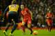 Liverpool's English midfielder Jordan Henderson (C) passes the ball during the English Premier League football match between Liverpool and Arsenal at Anfield stadium in Liverpool, north-west England on January 13, 2016.
AFP PHOTO / PAUL ELLIS
RESTRICTED T