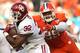 MIAMI GARDENS, FL - DECEMBER 31: Samaje Perine #32 of the Oklahoma Sooners carries the ball as Kevin Dodd #98 of the Clemson Tigers attempts to tackle him in the first quarter during the 2015 Capital One Orange Bowl at Sun Life Stadium on December 31, 20