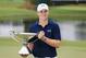 ATLANTA, GA - SEPTEMBER 27: Jordan Spieth of the United States poses on the 18th green after winning both the TOUR Championship By Coca-Cola and the FedExCup at East Lake Golf Club on September 27, 2015 in Atlanta, Georgia (Photo by Sam Greenwood/Getty