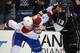 Mar 3, 2014; Los Angeles, CA, USA; Montreal Canadians defenseman Jarred Tinordi (24) and Los Angeles Kings left wing Kyle Clifford (13) fight in the first period at Staples Center. Mandatory Credit: Kirby Lee-USA TODAY Sports