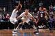 BROOKLYN, NY - JANUARY 15 : Damian Lillard #0 of the Portland Trail Blazers looks to pass the ball in double coverage against the Brooklyn Nets on January 15, 2015 at Barclays Center in Brooklyn, New York. NOTE TO USER: User expressly acknowledges and ag