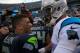 CHARLOTTE, NC - JANUARY 17: Cam Newton #1 of the Carolina Panthers meets Russell Wilson #3 of the Seattle Seahawks on the field after the NFC Divisional Playoff Game at Bank of America Stadium on January 17, 2016 in Charlotte, North Carolina. (Photo b