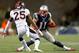 FOXBORO, MA - NOVEMBER 02: Julian Edelman #11 of the New England Patriots evades a tackle by Chris Harris Jr. #25 of the Denver Broncos during the first quarter at Gillette Stadium on November 2, 2014 in Foxboro, Massachusetts. (Photo by Jim Rogash/Gett