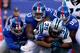EAST RUTHERFORD, NJ - DECEMBER 20: Mike Tolbert #35 of the Carolina Panthers gets tackled by Kerry Wynn #72, Jasper Brinkley #53 and Cullen Jenkins #99 of the New York Giants in the first half during their game at MetLife Stadium on December 20, 2015 in