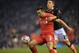Exeter City's English striker Tom Nichols (R) vies with Liverpool's Spanish defender Jose Enrique during the English FA Cup third round replay football match between Liverpool and Exeter City at Anfield in Liverpool, north west England on January 20, 2016