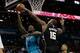 Jan 16, 2016; Charlotte, NC, USA; Charlotte Hornets forward Marvin Williams (2) has his shot blocked by Milwaukee Bucks center Greg Monroe (15) during the second half at Time Warner Cable Arena. The Bucks defeated the Hornets 105-92. Mandatory Credit: Jer
