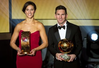 ZURICH, SWITZERLAND - JANUARY 11: FIFA Women's World Player of the Year winner Carli Lloyd of the USA and Houston Dash and FIFA Ballon d'Or winner Lionel Messi of Argentina and FC Barcelona pose together with their trophies after the FIFA Ballon d'Or Gala