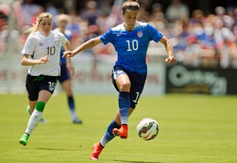 SAN JOSE, CA - MAY 10:  Carli Lloyd #10 of the United States takes off with the ball against Denise O'Sullivan #10 of Ireland in the first half of their international friendly match on May 10, 2015 at Avaya Stadium in San Jose, California.  The U.S. won 3