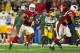 GLENDALE, AZ - JANUARY 16: Wide receiver Larry Fitzgerald #11 of the Arizona Cardinals runs with the football on a 75 yard reception against the Green Bay Packers in overtime of the NFC Divisional Playoff Game at University of Phoenix Stadium on January