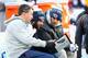 Titans coaches work with Zach Mettenberger and Marcus Mariota on the sidelines.