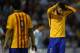 Barcelona's defender Gerard Pique (R) gestures during the Spanish league football match Celta Vigo vs FC Barcelona at the Balaidos stadium in Vigo on September 23, 2015. AFP PHOTO / MIGUEL RIOPA (Photo credit should read MIGUEL RIOPA/AFP/Getty Ima