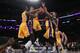 LOS ANGELES, CA - JANUARY 22: Julius Randle #30, Anthony Brown #3 and Tarik Black #28 of the Los Angeles Lakers vie for the loose ball with Boban Marjanovic #40 of the San Antonio Spurs during the NBA game at Staples Center on January 22, 2016 in Los Ang