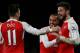 Arsenal's French striker Olivier Giroud (R) celebrates scoring his team's second goal with Arsenal's English midfielder Theo Walcott (R) and Arsenal's German midfielder Mesut Ozil during the English Premier League football match between Arsenal and Manche