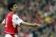 LONDON, UNITED KINGDOM: Arsenal's Spanish forward Jose Reyes throws his necklace to a staff members after he was ordered to take it off playing Manchester United in their FA Cup semi-final clashat Villa park in Birmingham, 03 April 2004.Manchester United
