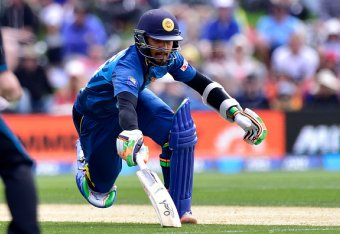 Dinesh Chandimal of Sri Lanka makes his ground during the 2nd ODI cricket match between New Zealand and Sri Lanka in Christchurch at Hagley Park on December 28, 2015.   AFP PHOTO / MARTY MELVILLE / AFP / Marty Melville        (Photo credit should read MAR