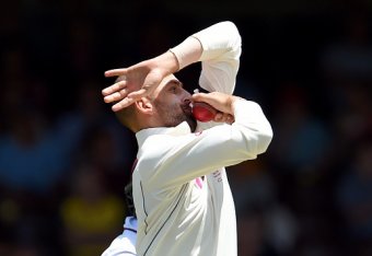 TOPSHOT - Australian spinner Nathan Lyon sends down a delivery to the West Indies batsman on the final day of the third cricket Test match in Sydney on January 7, 2016.  AFP PHOTO / William WEST  
--IMAGE RESTRICTED TO EDITORIAL USE - NO COMMERCIAL USE-- 